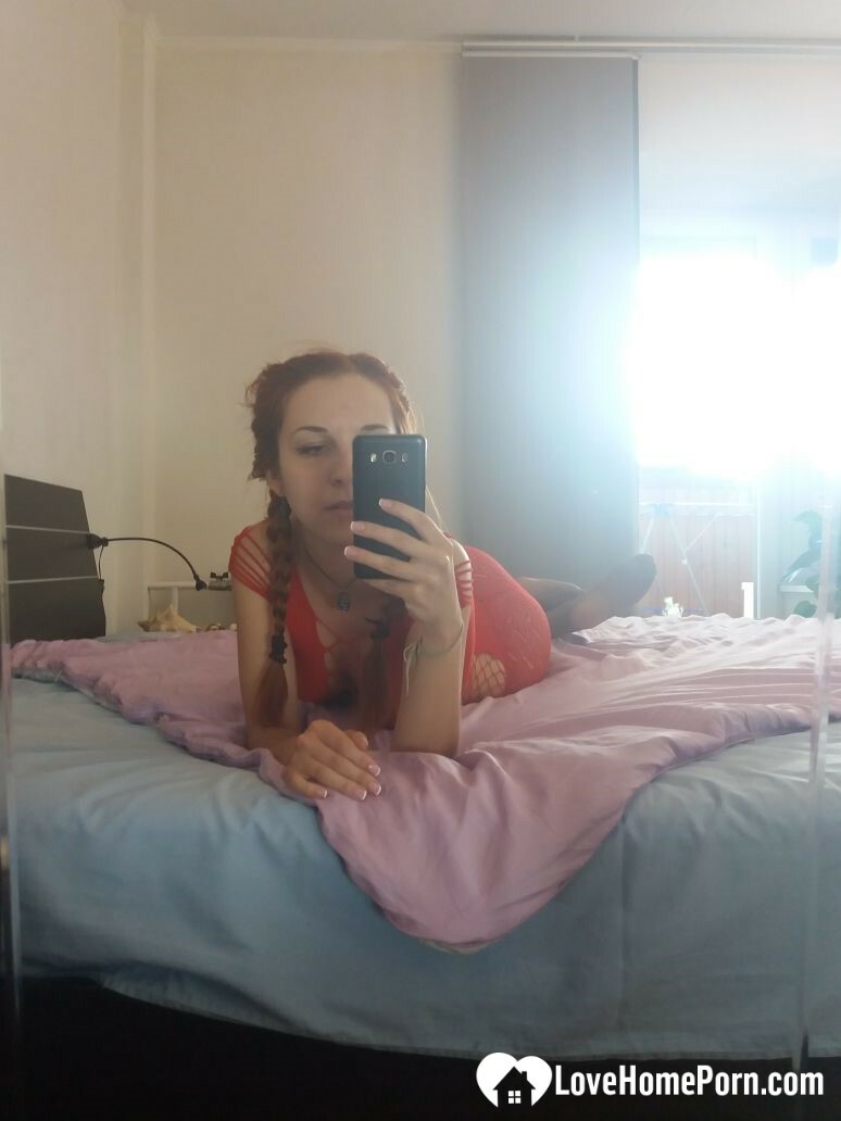 Smoking redhead teases in stockings in the bedroom — 59